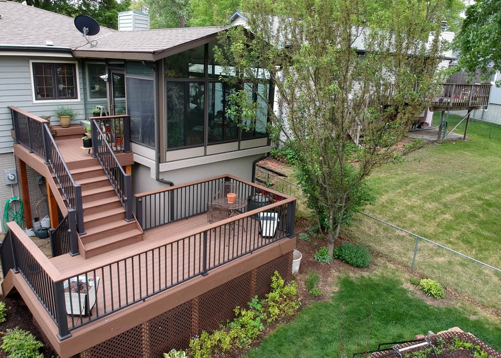 backyard with sunroom and composite deck.