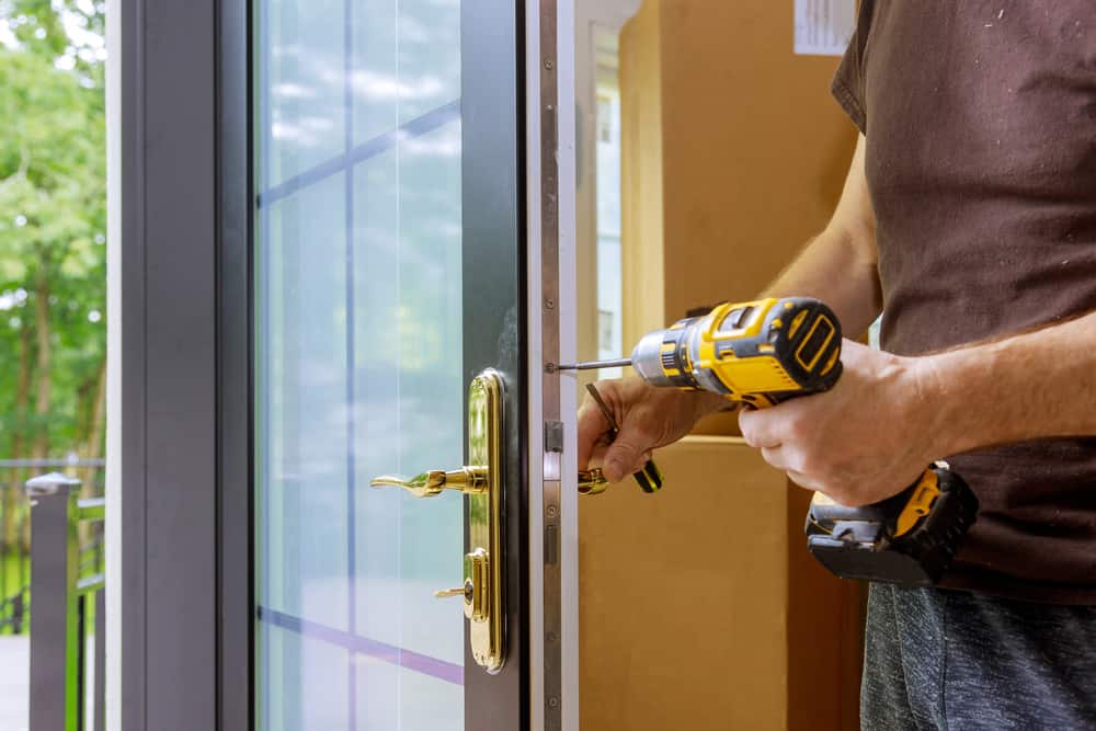 man installing door handle.