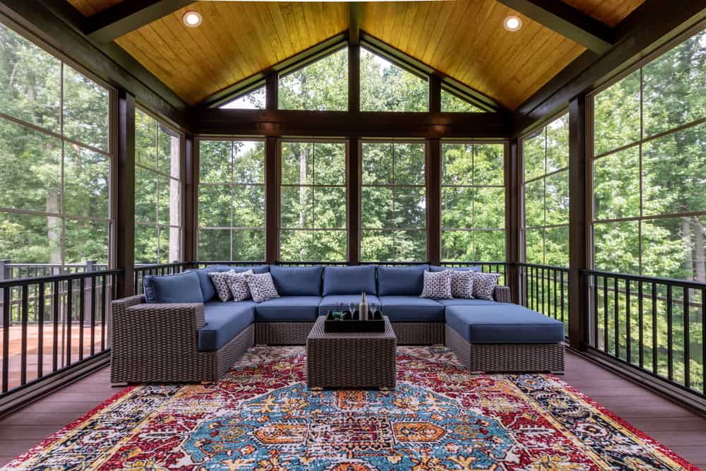 large sunroom with patio furniture.